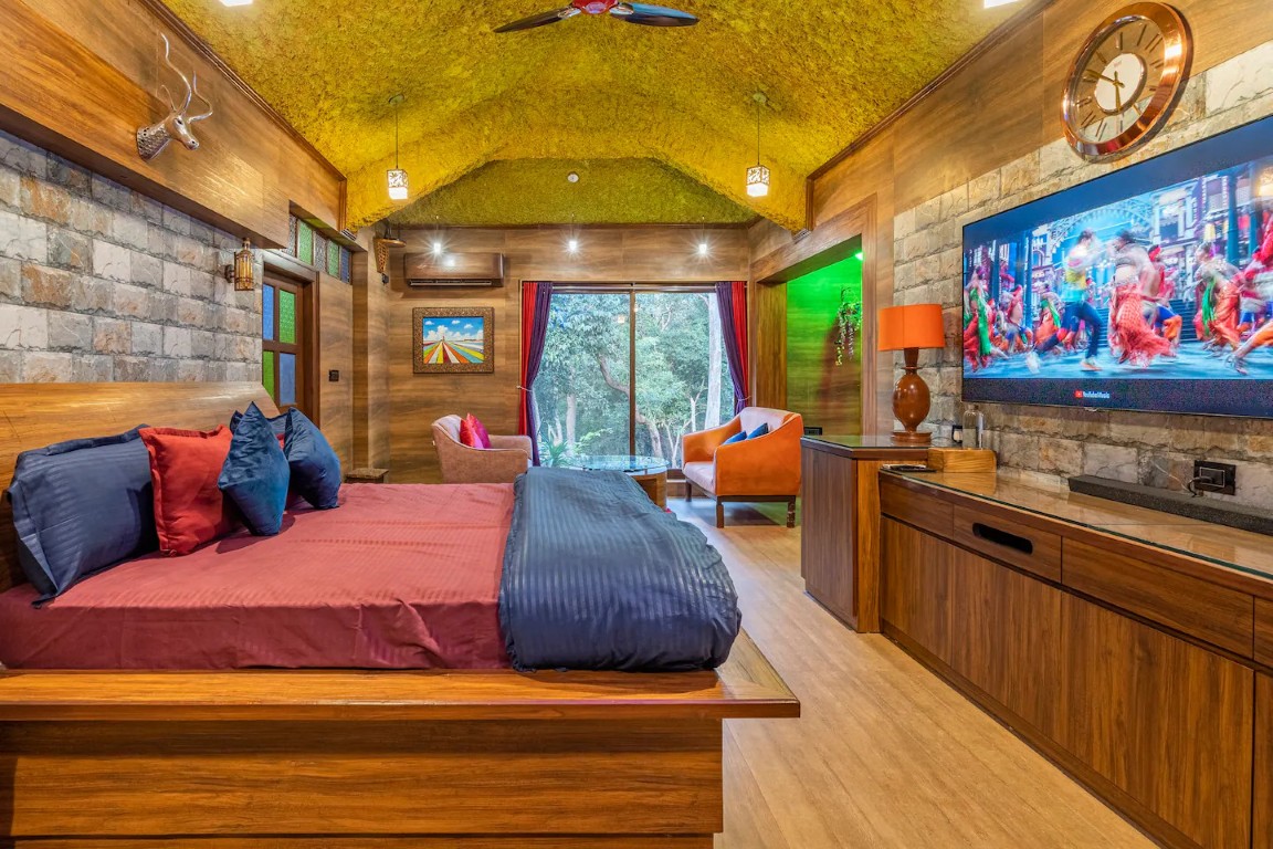 Modern bedroom with garden view and office table